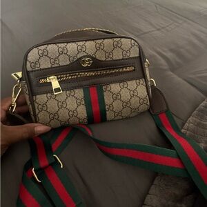 inspired  Beige cross body bag with Red and Green Accents.